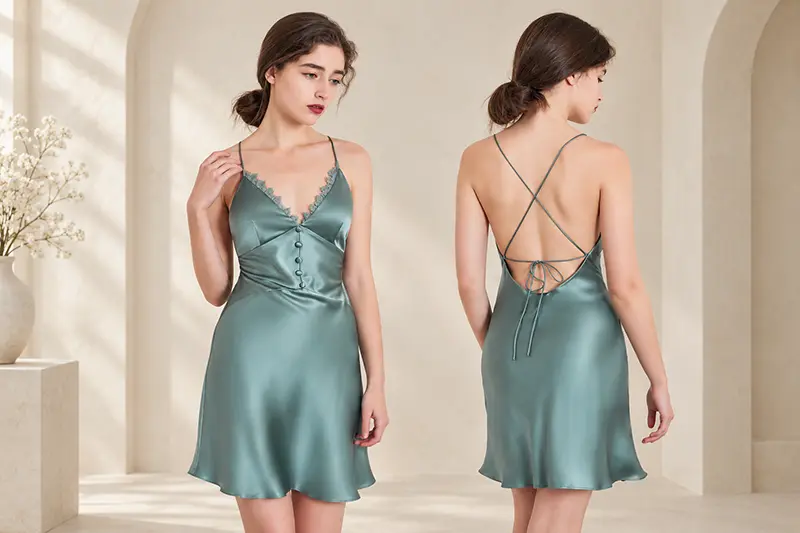Green lace-trim silk slip dress with crossed back straps, shown from both sides