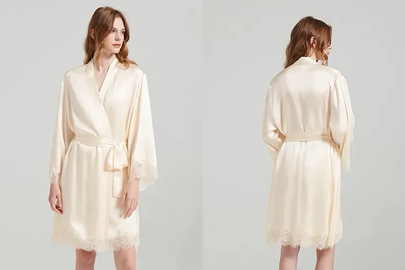 Ivory wrap silk robe with a shawl collar and lace trim shown front and back