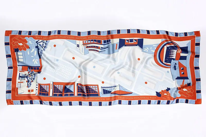 Long rectangular silk scarf laid flat with an illustrated print and striped border