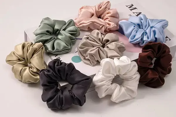 silk scrunchies in muted green, pink, blue, beige, gray, ivory and dark colors