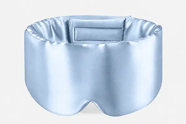 Pale blue wraparound silk sleep mask with a broad padded band